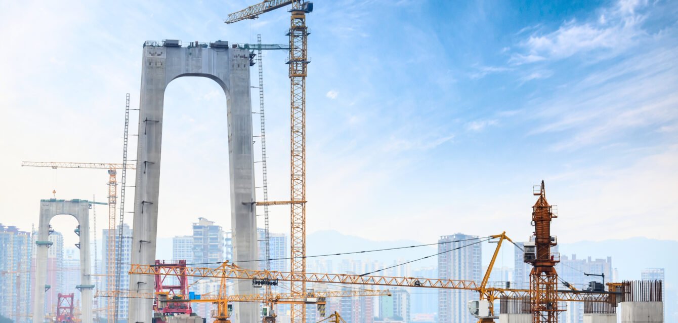Construction of tall concrete pylon of bridge using tower crane