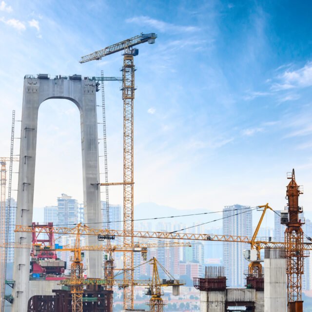 Construction of tall concrete pylon of bridge using tower crane